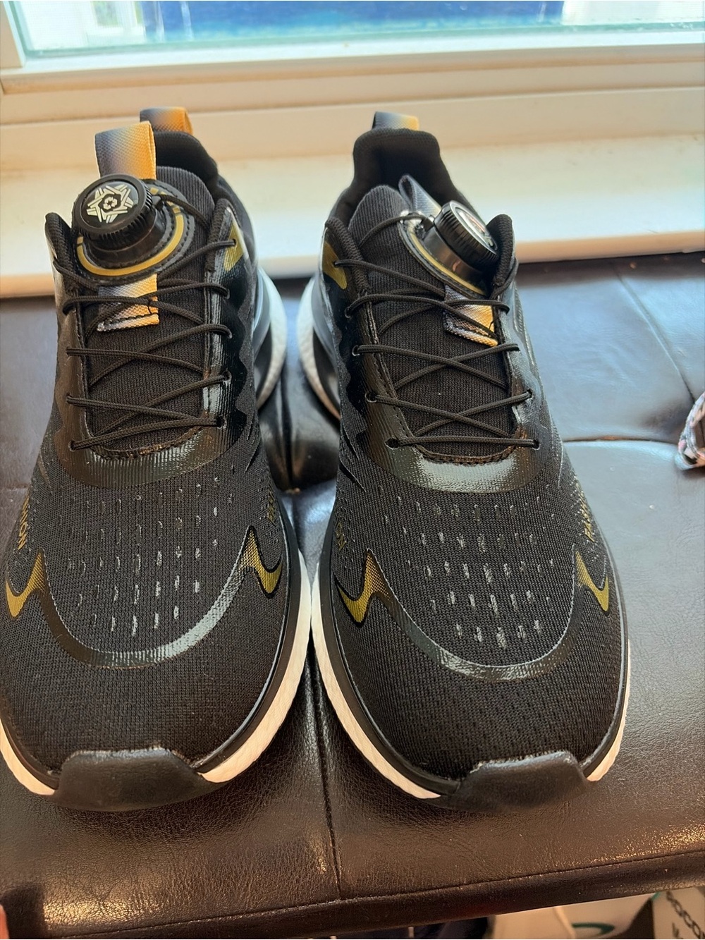 Black Athletic Sneakers with Gold Accents